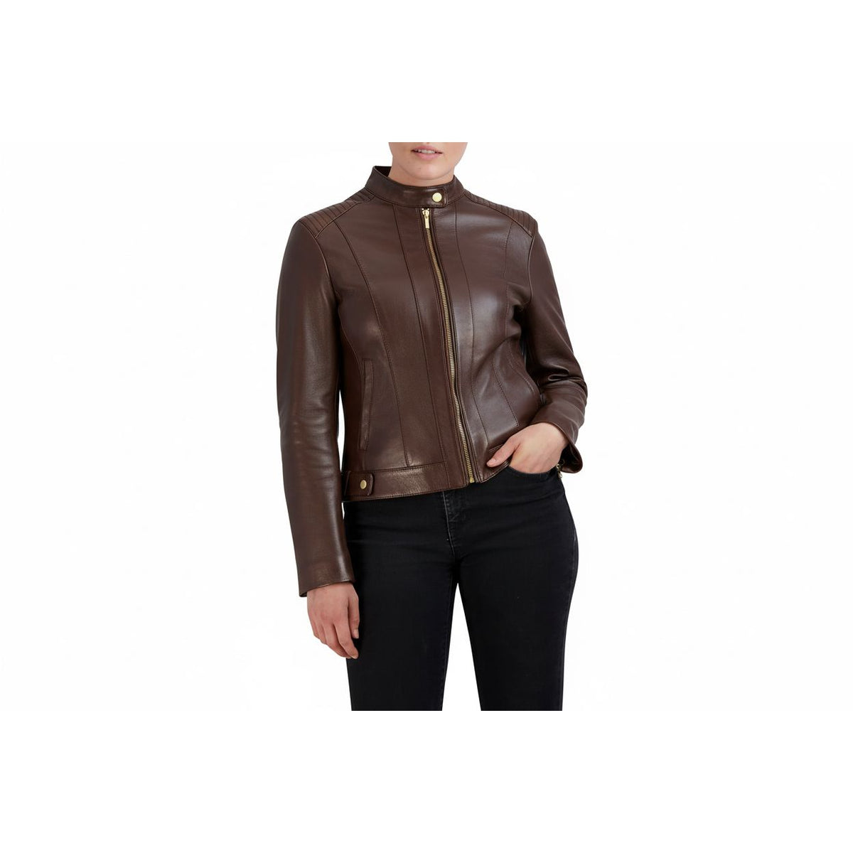 A woman wearing a chocolate leather moto jacket with gold-tone hardware, paired with black jeans, shown against a plain white background.