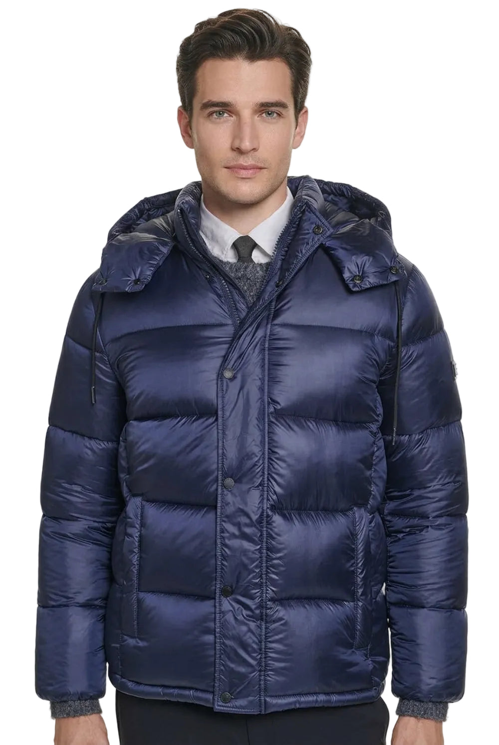 A man wearing a navy blue puffer jacket with a hood, shown from the neck down against a plain white background.