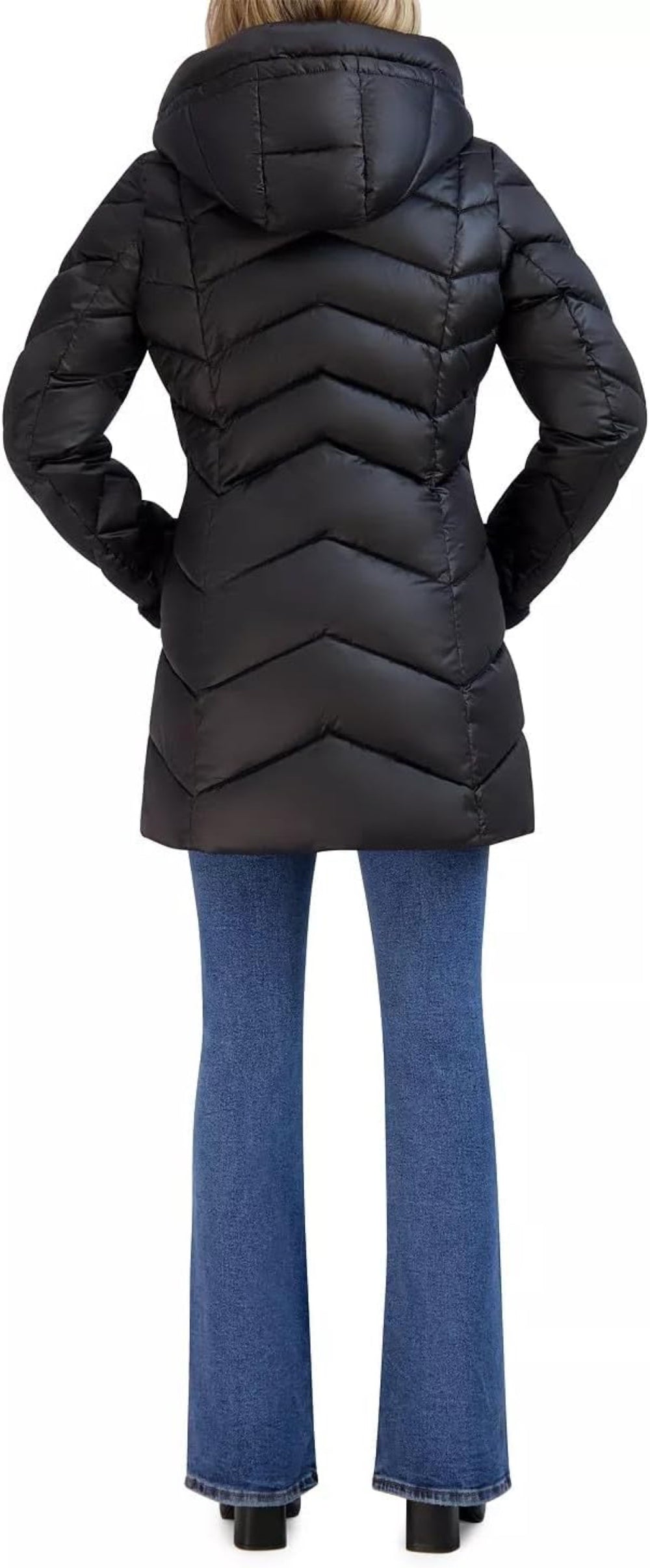 Black puffer coat worn by a person on a white background
