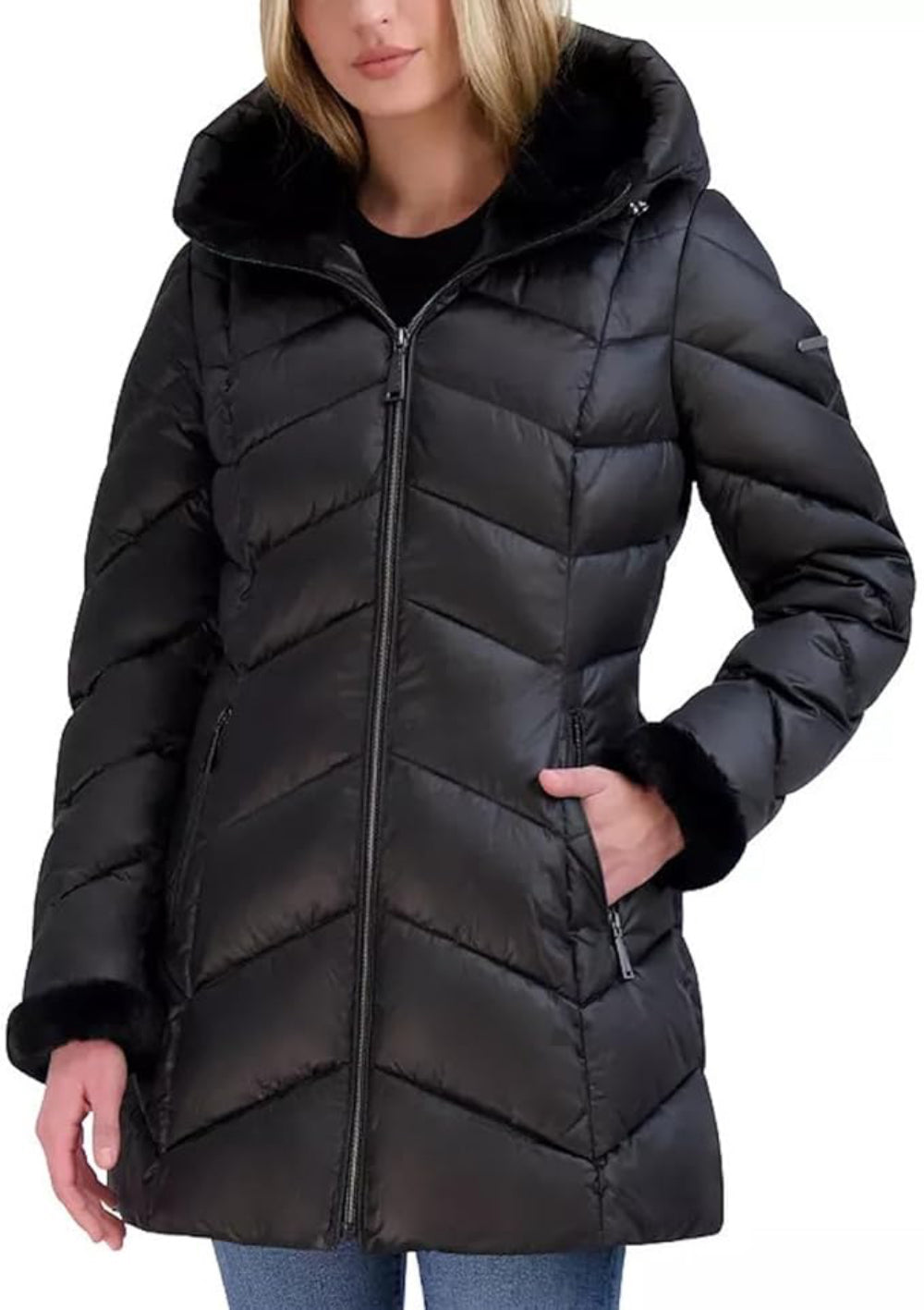 Black puffer coat worn by a person on a white background