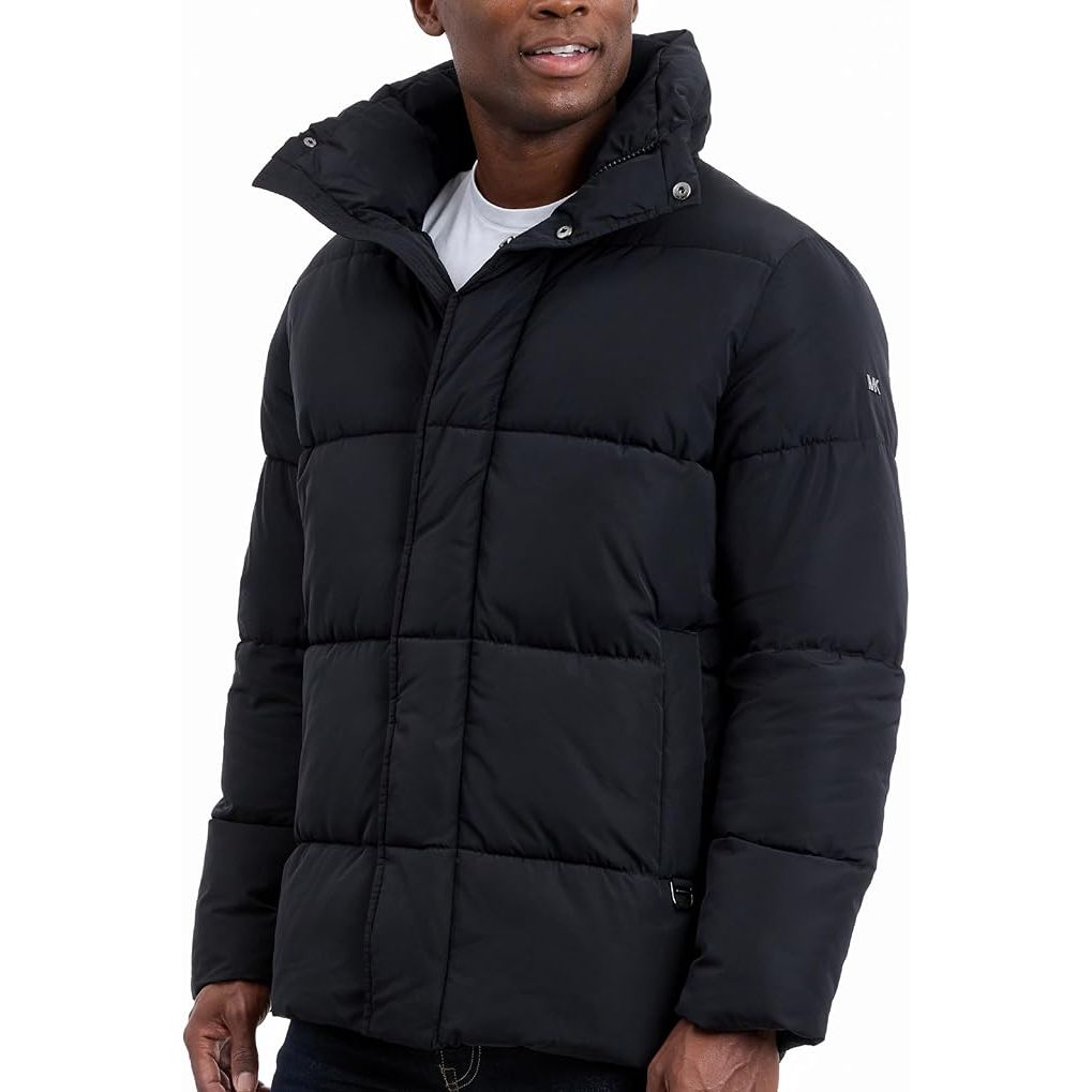 Man wearing a black puffer jacket on a white background