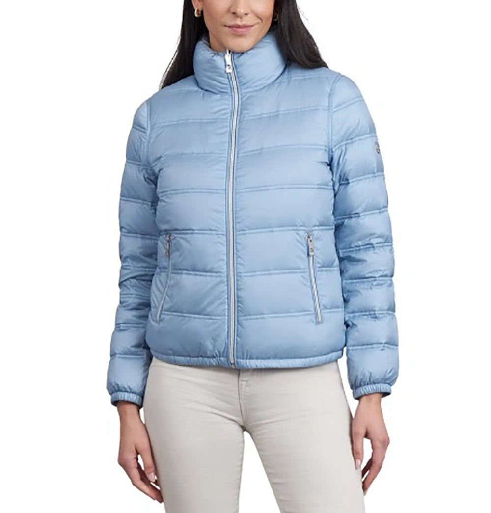 Light blue puffer jacket worn by a person on a white background