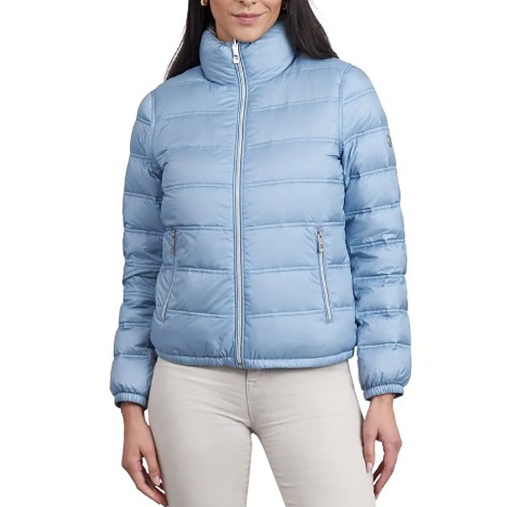 Light blue puffer jacket worn by a person on a white background