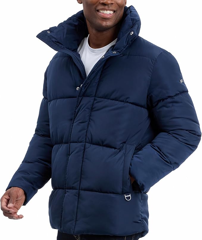Man wearing a navy blue puffer jacket on a white background