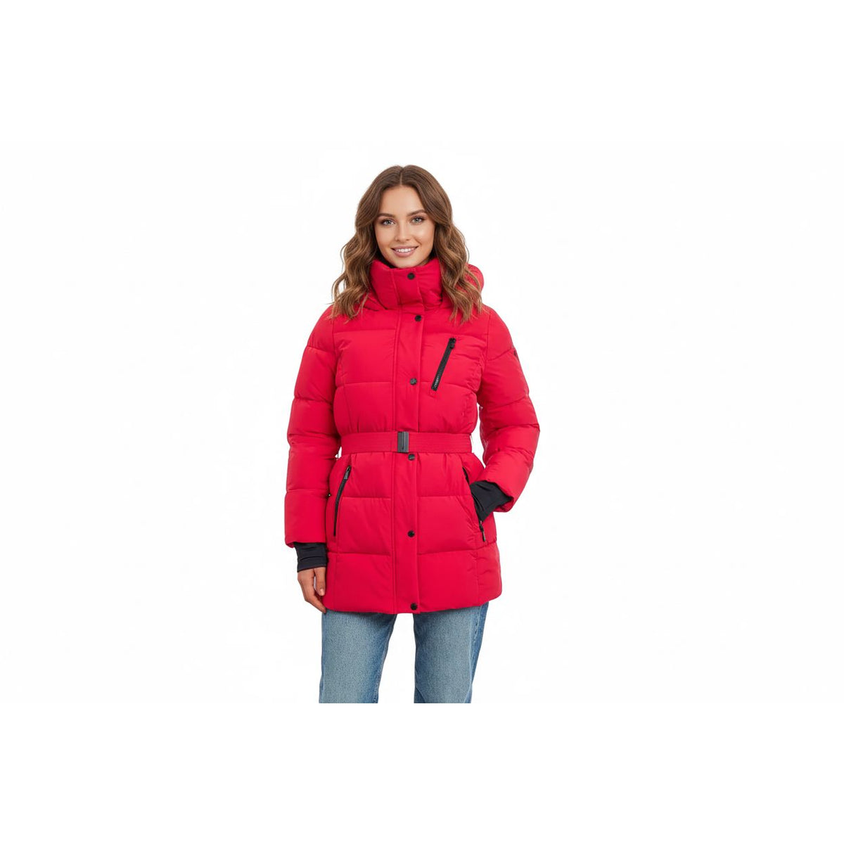 A woman wearing a red BCBGeneration puffer coat with a hood, featuring a coordinating belt, zipper pockets, and thumb holes in a simulated leather fabric.