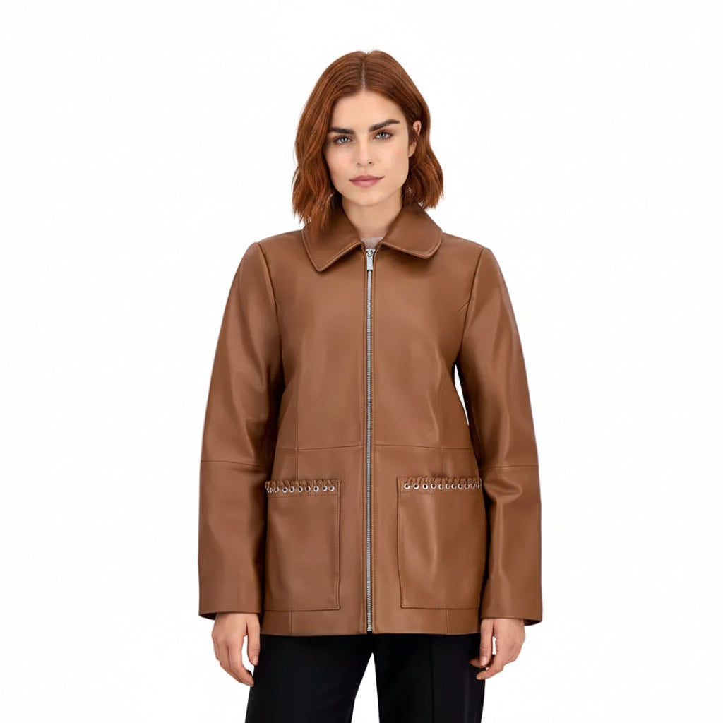 A woman modeling a brown genuine leather jacket with a silver front zipper and decorative silver chain accents on the front pockets, set against a plain light gray background.