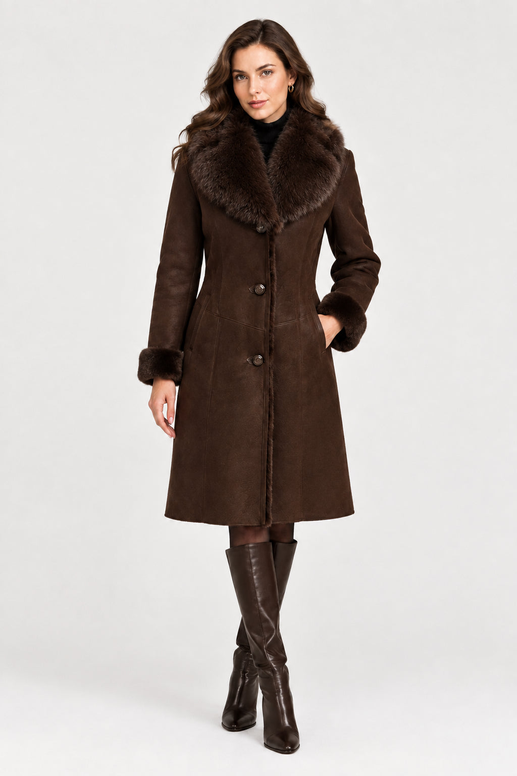 A dark brown shearling-style coat with a large brown and gray fur-trimmed collar, button front, and long sleeves, shown on a plain white background.
