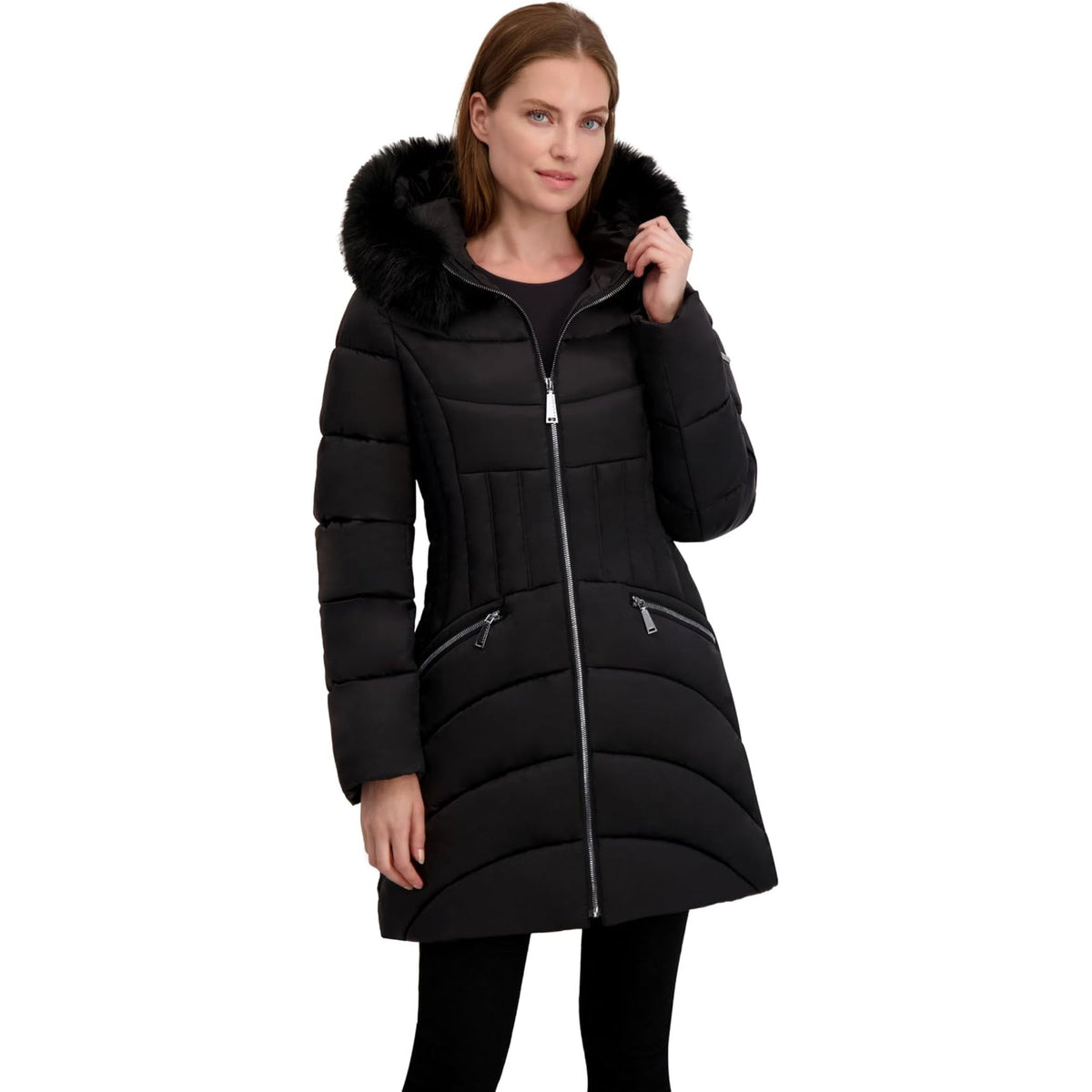 A woman wearing a black quilted winter parka with a large black faux-fur trimmed hood and silver zipper details, shown against a plain white background.