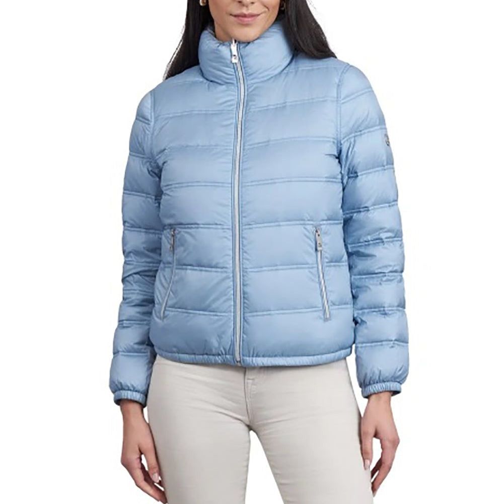 Light blue puffer jacket worn by a person on a white background