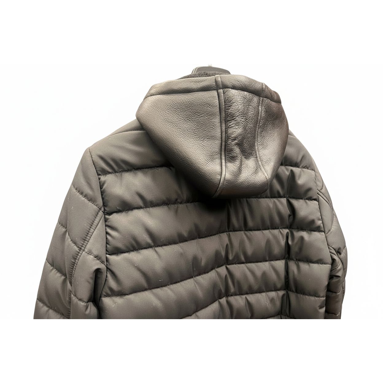 Gray puffer jacket with a hood on a white background