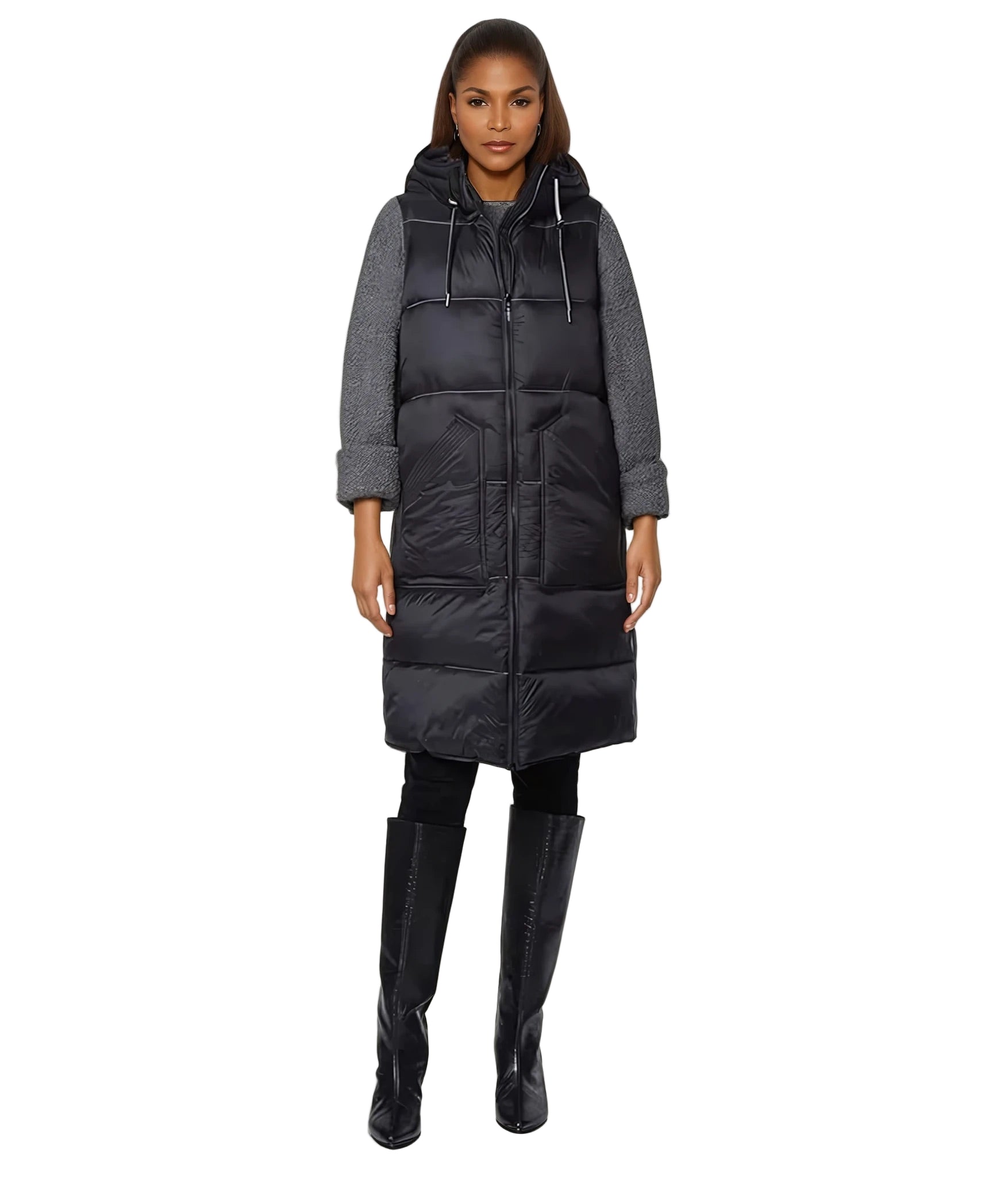 Woman wearing a long black puffer coat with a gray hoodie on a white background